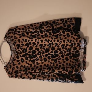 Cheetah print with button back and elbow detail!